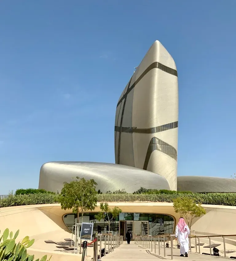 The King Abdulaziz Center for World Culture, Ithra, in Dammam: a tall silver tower of stacked curved forms.