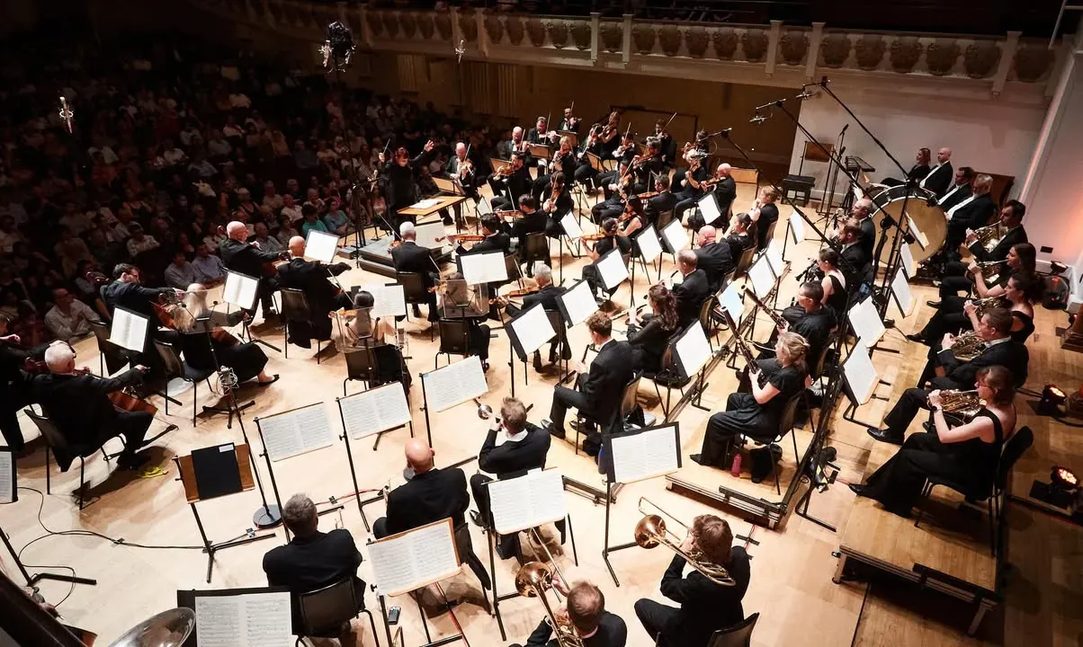 The orchestra in a concert hall, seen from above