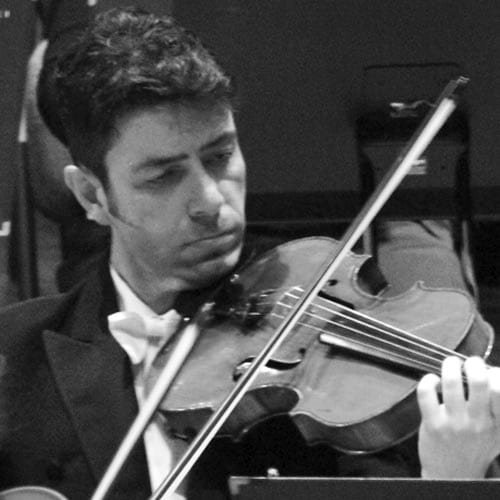 Mark Chivers playing the viola in concert dress, photographed in black and white during a performance.